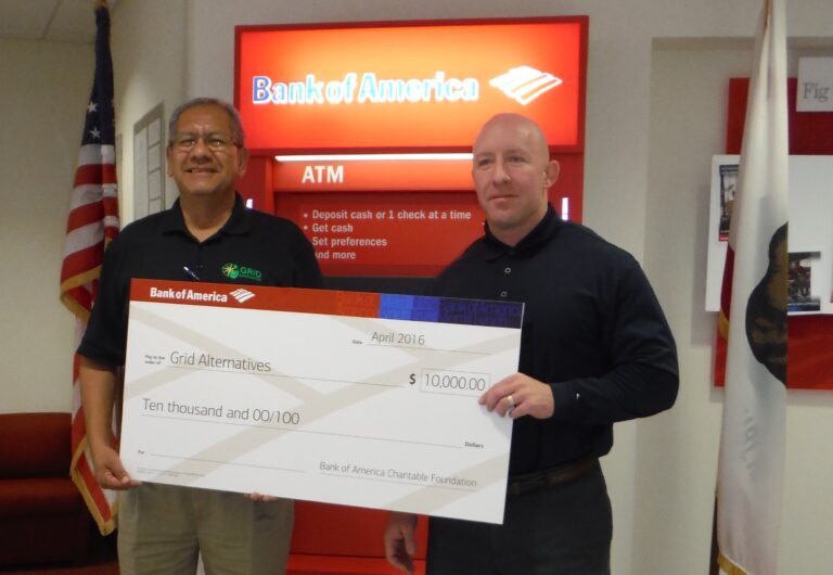 Two men hold a $10,000 check from Bank of America Charitable Foundation to Grid Alternatives, April 2016