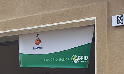 Rabobank banner reading "A proud sponsor of GRID" displayed on building entrance 69