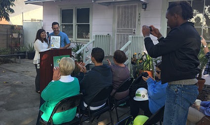 Community gathering celebrating 200 completed projects in Long Beach with awards and remarks from partners and residents