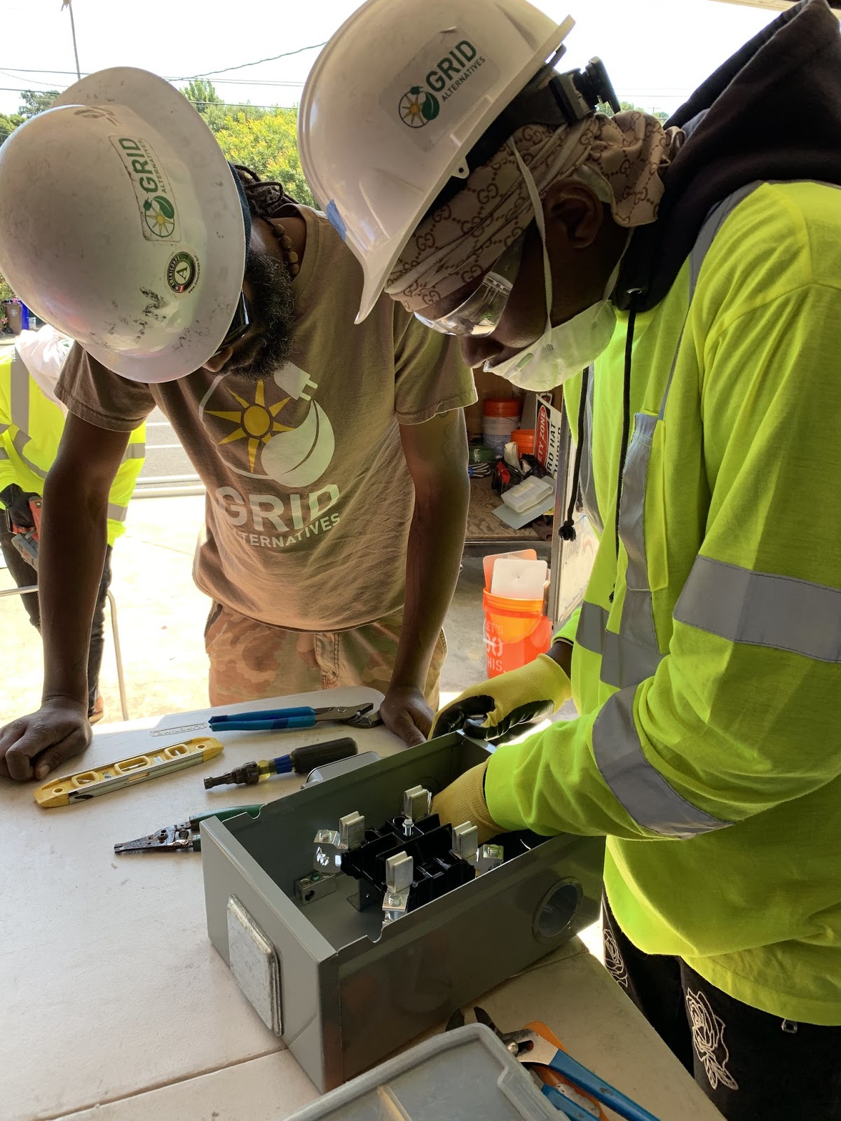 IMG: Job Trainee Kmani setting up a meter
