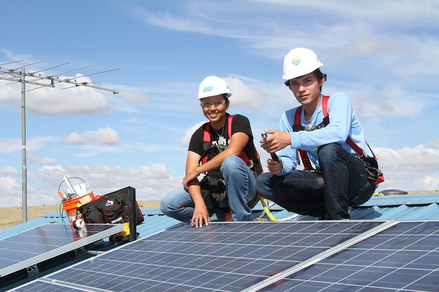 solar installers on the roof