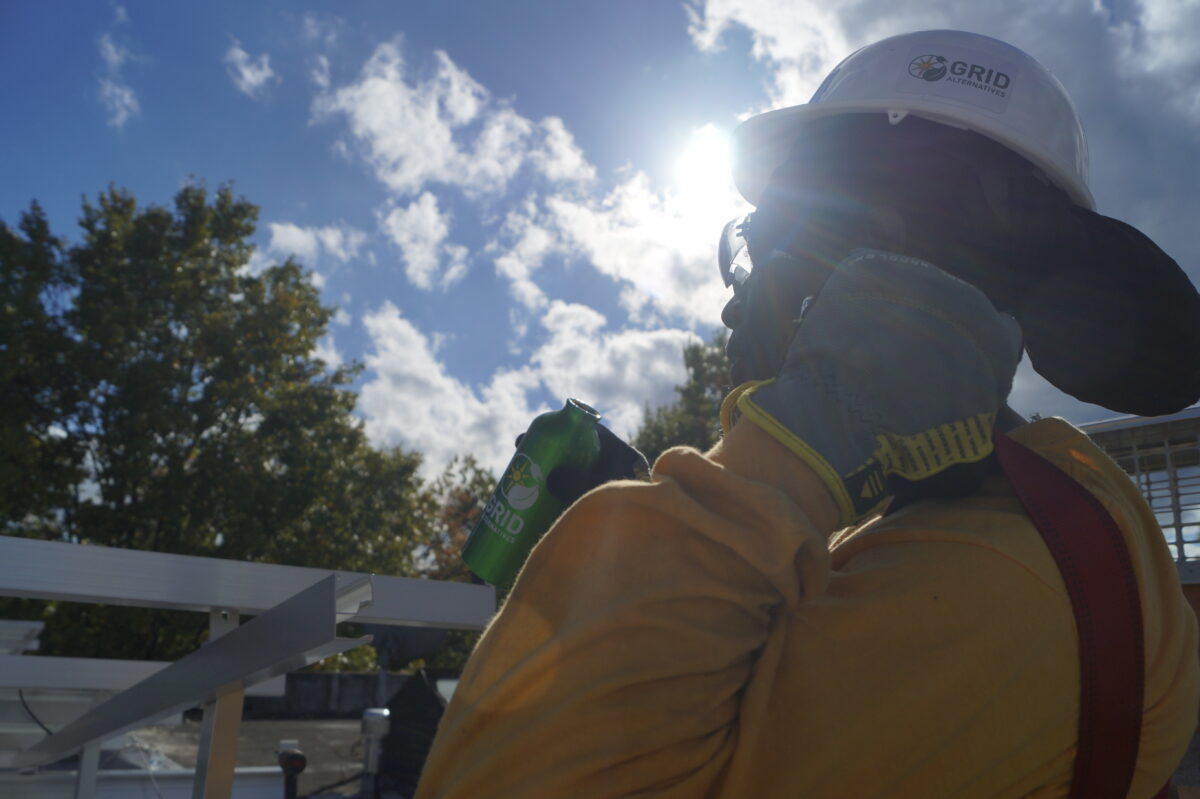 A Solar Works DC trainee takes a break during an install.