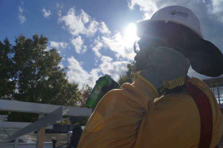 A Solar Works DC trainee takes a break during an install.