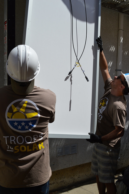 The team lifts the panels