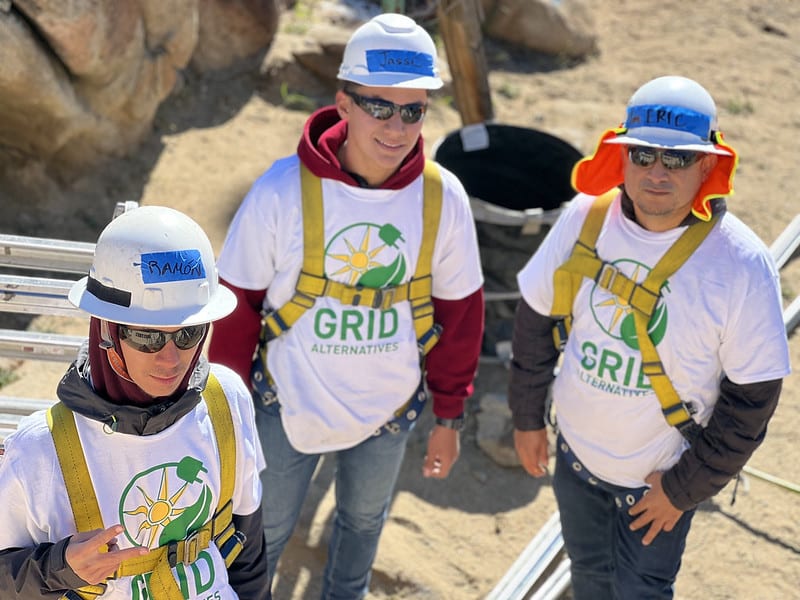 Hermano Pablo - 3 student installers on the ground looking up