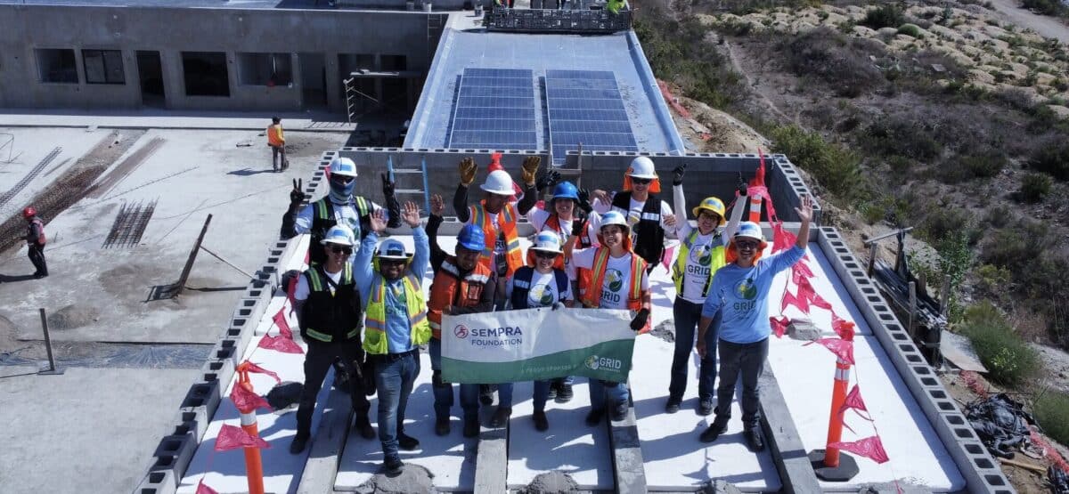 Renewable energy students from Tijuana on the roof with solar system