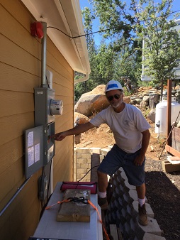 Homeowner flipping the switch on their GRID installed solar