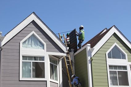 Trainees and GRID staff installing for Aguayo Family