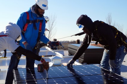 CivicWorks and volunteers install solar