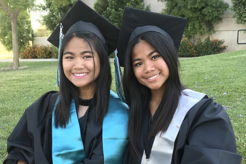 Fraternal twins, Claire and Glaire, on graduation day.