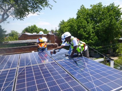 GZEP trainee installing solar panels