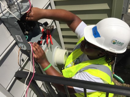 GZEP trainee working on the electrical part of installing solar