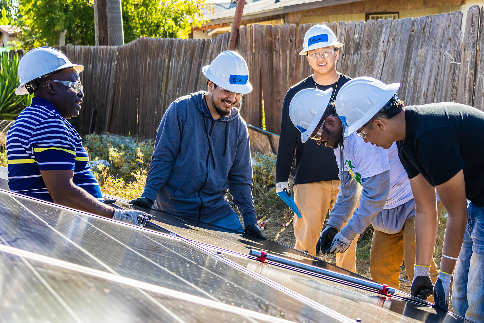 Group of people working on panel