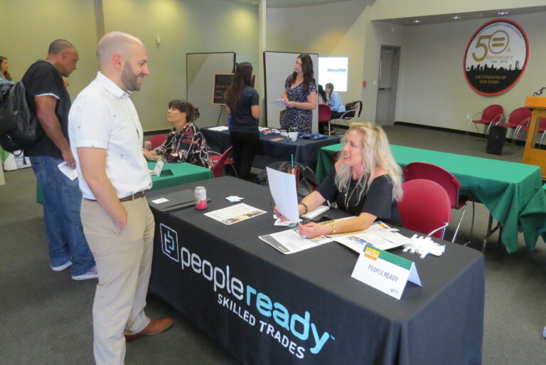 People Ready Skilled Trades booth at career event with staff talking to visitors