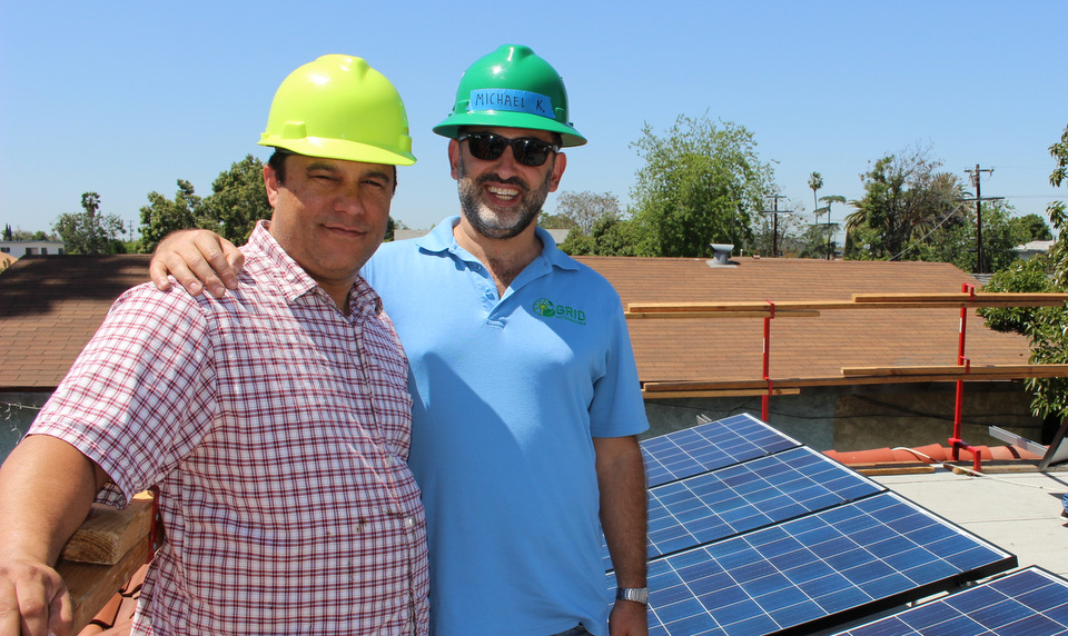 Homeowner Geoff Harjo (left) and GLA Executive Director Michael Kadish (right) admire the Harjo's solar system