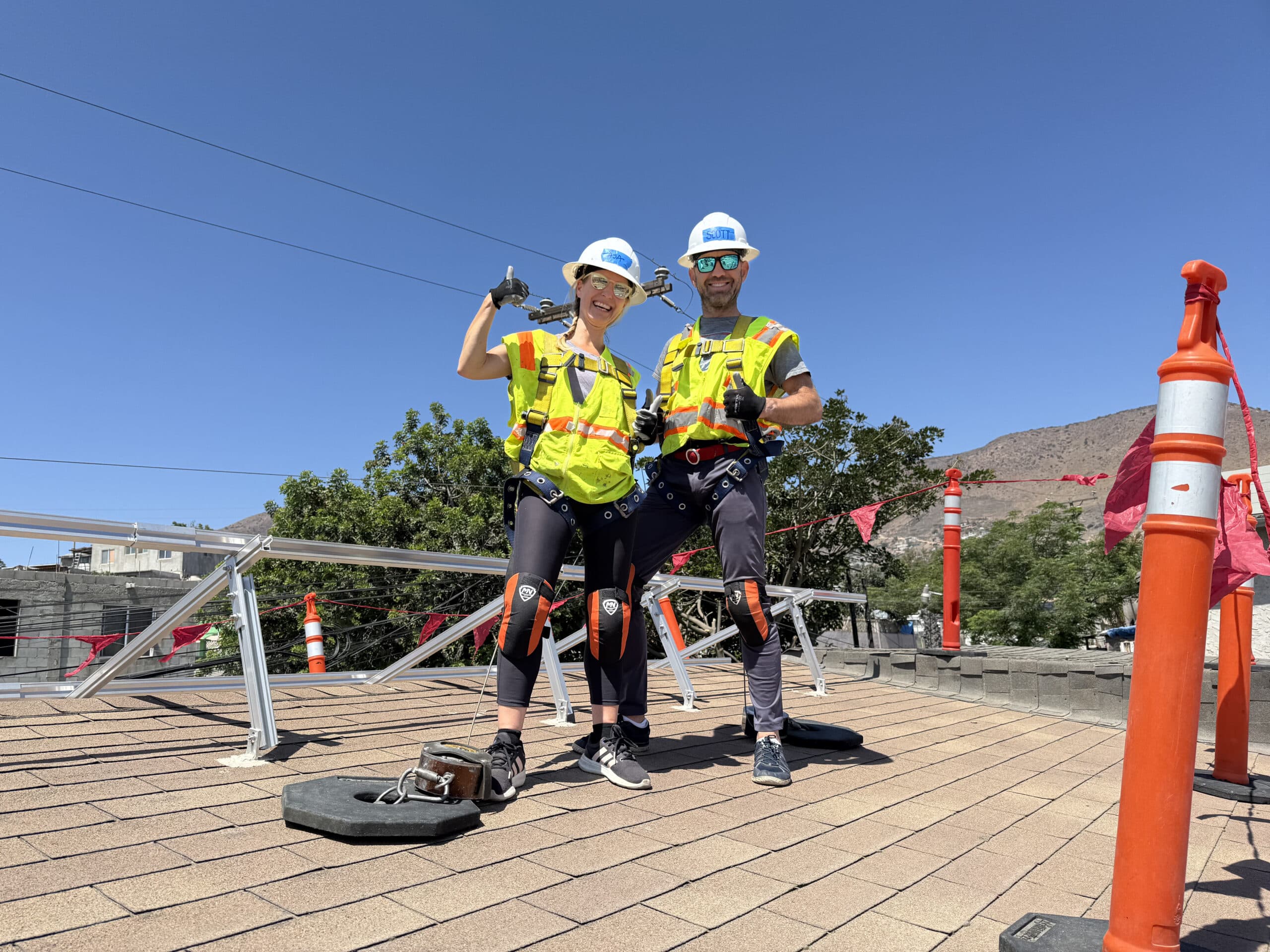International Volunteers Installing on Roof