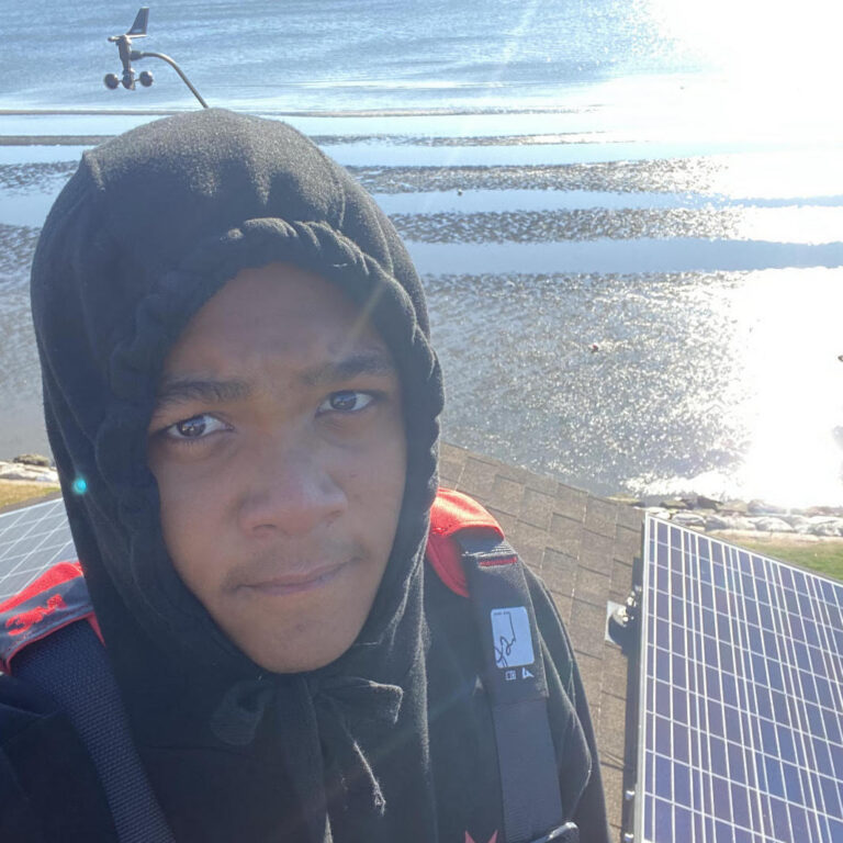 Solar Works DC trainee Jahlil Wormley working at his new job at Tesla Energy
