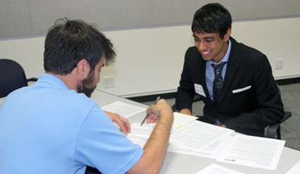GRID staff review resumes and provide feedback during the Bay Area Summer Job Fair.