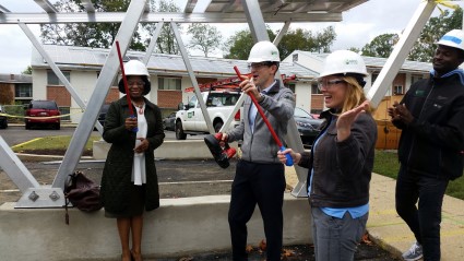 Nicole Steele with GRID, Chris VanArsdale with VNV Development, and Monica Warren-Jones with Enterprise cut conduit