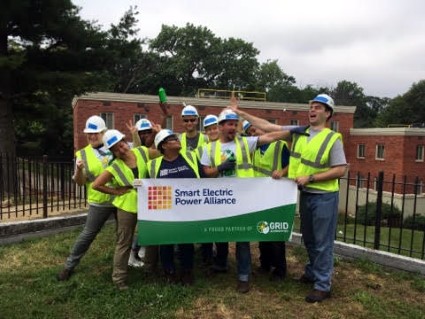 SEPA Corporate Workday volunteers pose with a banner