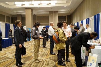 Solar Focus Job Fair attendees wait in line to talk to an employer