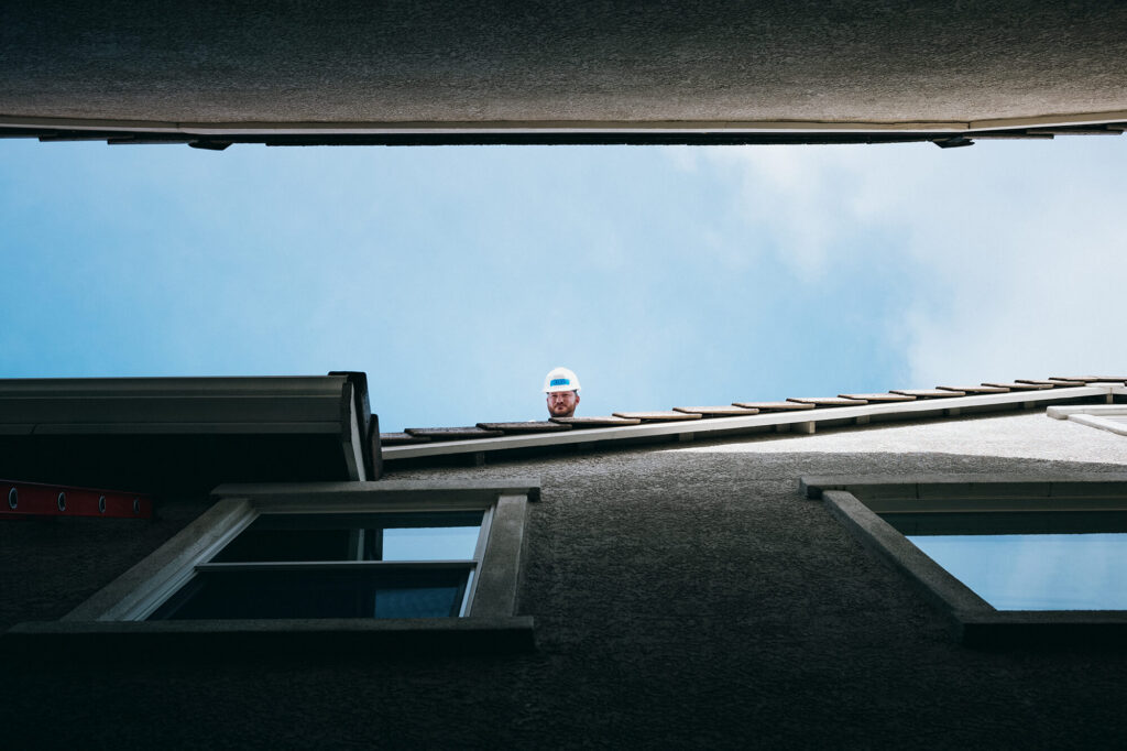 Person on roof looking down