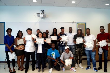 Solar Works DC participants pose with their graduation certificates