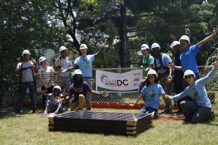 Solar Works DC job trainees pose by a banner