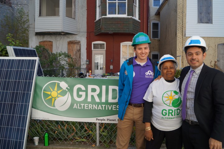 Tom with Civic Works, Homeowner Ms. Williams, and Albert with GRID