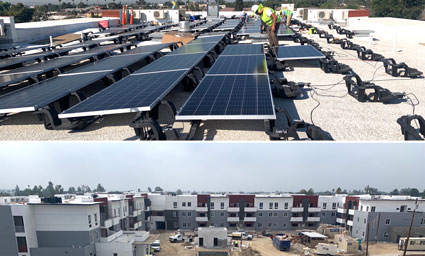Solar panels installed on rooftop and residential buildings under construction at VistaVerde