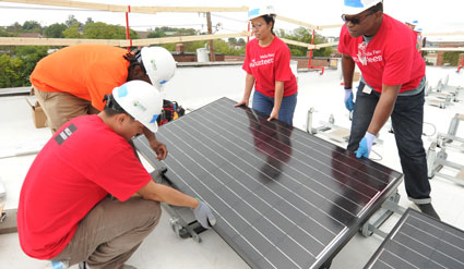 Volunteers install a panel on a home in the Ivy City neighborhood of Washington, D.C. helping to launch GRID's work in the Mid-Atlantic region in fall 2014.