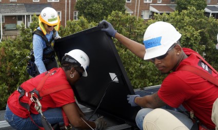 Wells Fargo volunteers install a solar panel