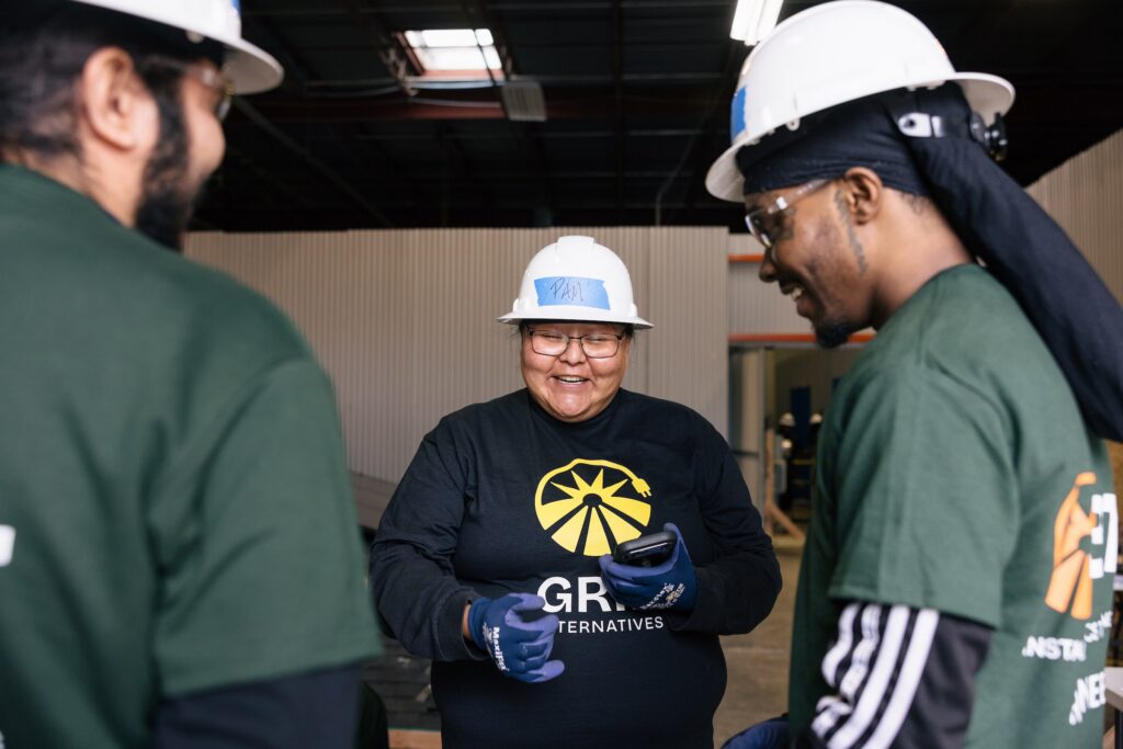 GRID staff and trainees working together in a workshop.