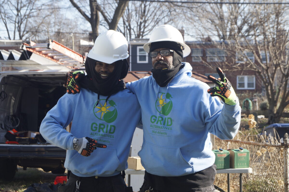 Tyjuan and Damon pose for a picture during an install in December 2022 in Washington DC.