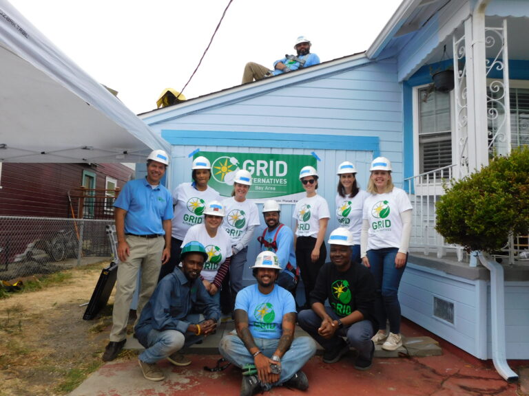 GRID Alternatives Bay Area construction team posing next to BMO[Bank of Montreal] volunteers