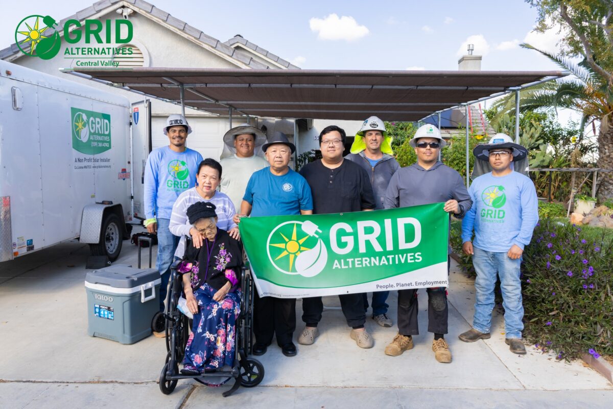 The Hang family along with the solar installation team.