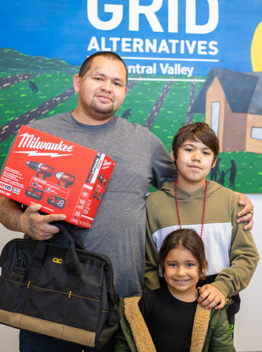 Michael Morales receiving his solar installation tools.