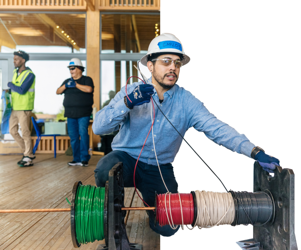 Person working with spool of wire