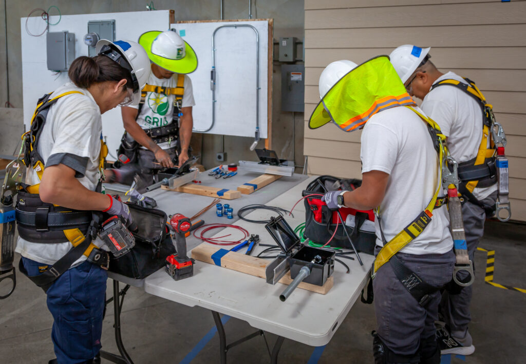 IBT 200 trainees learning how to wire junction boxes at the CTTC.