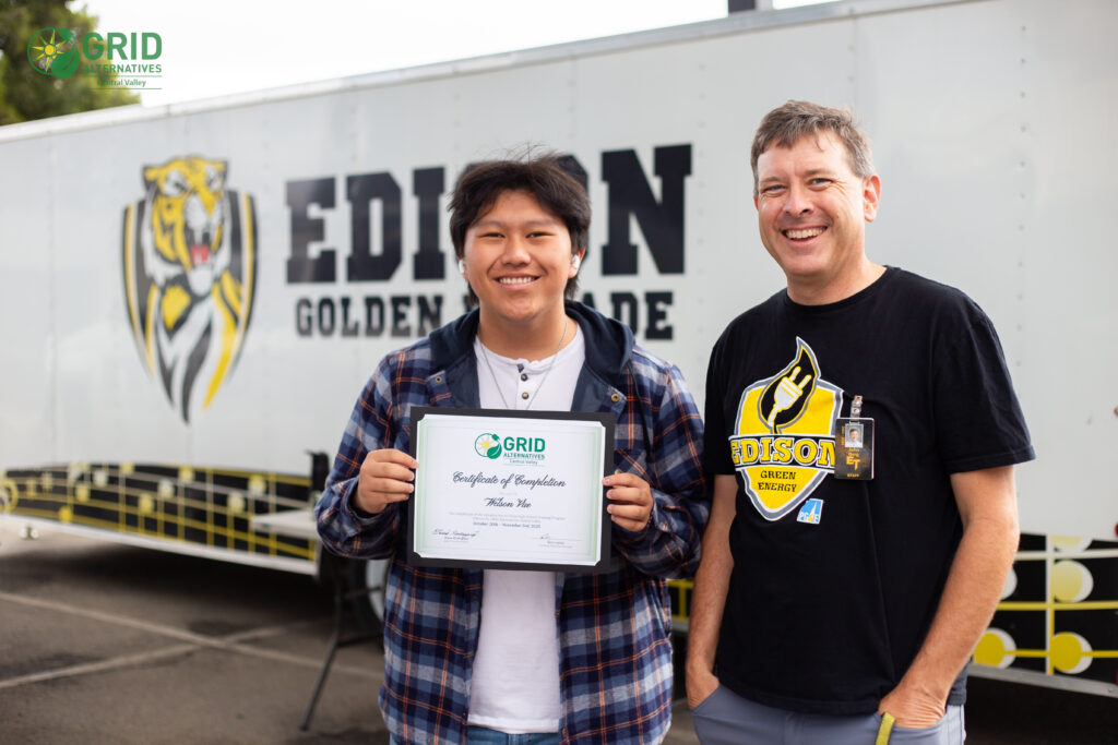 Welson Vue posing for photo with teacher