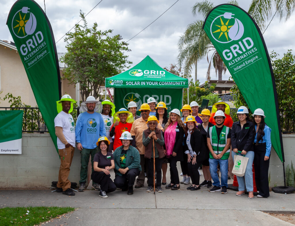 Mark (left) with GRID IE staff, VIP representatives from CAP Riverside, City of Riverside, and homeowner Lupe Fuentes (center)
